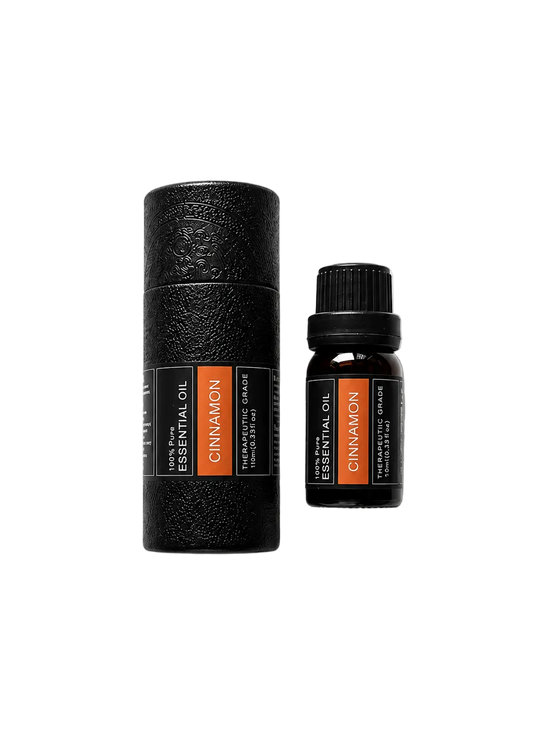 'Cinnamon' essential oil bottle and packaging on a transparent background