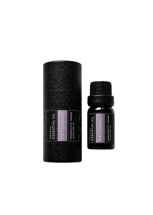 'Patchouli' essential oil bottle and packaging on a transparent background